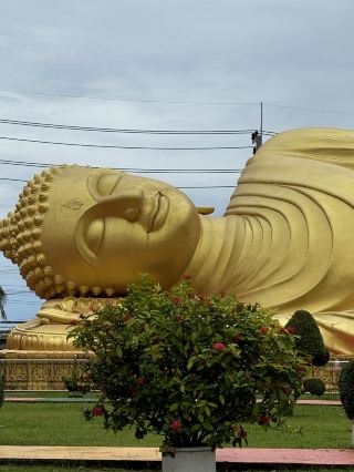 A Giant Buddha Sleeping Beside a Beautiful Lake