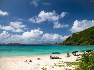 The largest of the Kerama Islands is Tokashiki Island🌊

During busy periods, it's best to book a ferry seat in advance, but I couldn't get one. So, we decided to try our luck and arrived at the port early in the morning and got in line at the ticket window.

Lucky us! It turns out they have reserved slots at the ticket counter, so if you're planning to visit this island, buying a ticket won't be a problem. However, you need to arrive 1.5 hours before departure.

While we were on the ferry, I discovered I was seasick🤣. I was severely seasick for about 30 minutes and thought I was going to pass out. But on the way back, everything was fine.

The island itself is incredibly beautiful. Pure white sand, clear azure water... A rich underwater world, and we were lucky enough to swim with sea turtles.

 By the way, transportation to the beaches is very well developed here. When you get off the ferry, you're offered a pass for roundtrip bus travel and luggage storage. They take you to an equipped beach, where you can rent snorkeling gear. Very convenient. There's also a cafe where you can have lunch; it's quite decent, though a bit pricey. Showers are free, and sun loungers are available for an extra fee.

The swimming area is fenced off and there are lifeguards, but if you go beyond their zone, your safety is entirely up to you. We actually went well beyond the zone, as it's the only place to find turtles, but the reefs are very close, so there's a high risk of cuts. Sometimes we had to swim very carefully, and in some places it was scary. In a couple of places, I couldn't figure out how to move without ripping my stomach open. And with a mask, everything looked closer than it actually was. Overall, it was fun.

#japan#okinawatrip#okinawa#travel#beachlife#tokashiki