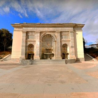 Check in the magnificent neoclassical fountain 🪨