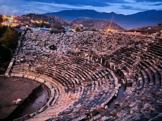 #winterescape Step into Ancient Legends at Letoon Antik Kenti 🏛️☀️  
Feel history come alive as you wander among sun-baked ruins, hidden amidst peaceful countryside near Kumluova. Letoon Sanctuary Place is perfect for travelers keen on archaeology, culture, or simply finding inspiration in deserted ancient theaters at dusk.

Begin your journey at the main entrance on Kumluova, 48370 Seydikemer/Muğla. Arrive in the late afternoon for that golden light—perfect for capturing the hauntingly beautiful Roman theater, especially when it’s deserted and shadows dance on stone seats. Walk through the tranquil sanctuary remains, imagining the bustling ancient rituals once held here.

Must-do activities:
Explore the theater ruins and the remains of the three temples dedicated to Leto, Artemis, and Apollo. Pause for a quiet moment beside the old mosaic floors; they’re easy to miss but rewarding for photographers and history lovers alike.

Top photo spots:
Best “insta-worthy” shots are at the ancient theater, especially as the sun sets and the silhouettes lengthen. Angle your camera to catch the sprawling columns and open-air landscape—outdoor cultural vision meets timeless architecture!

Practical visiting tips:
Letoon is open year-round, from 8:30 AM–5:30 PM. Wear comfy shoes; the terrain is uneven and can get quite sunny. Bring water and sunscreen, as facilities are limited and there’s little shade. For a peaceful experience, visit later in the day when most tours have finished.

Key precautions:
Some ruins are delicate—avoid climbing and respect all barriers. Watch your step, especially around broken stones.

#Letoon #Kumluova #AncientRuins #HistoryTravel #OutdoorCulture