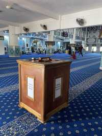 The mosque features intricate Islamic calligraphy 