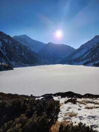 Still waters, snowy peaks, and silence
