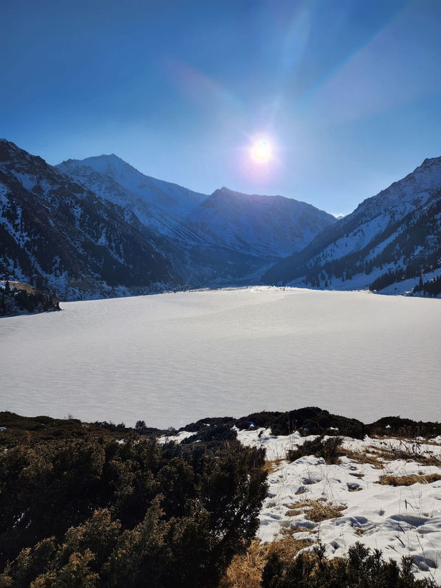 Still waters, snowy peaks, and silence