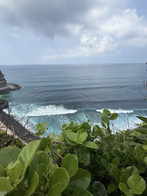 We started at 6 AM from Nusa Dua and finished late at night in Kuta, filled with emotions and absolutely happy.

1. Pura Luhur Uluwatu in the morning waves.
Yes, everyone recommends visiting at sunset, but we began our day here at sunrise—and didn’t regret it for a second. The temple, perched above the ocean, was serene and majestic in the morning light, without the evening crowds. Silence, only the sound of the surf and the wind in your ears. A perfect start to the day and a powerful dose of tranquility.

2. Sacred Monkey Forest in Ubud.
A complete contrast! From the solitude of the temple to the vibrant life of the tropical forest. The monkeys here are the true rulers, and you can watch their antics for hours. Pro tip: watch your step! We had a hilarious moment when we accidentally stepped on a monkey’s tail. Both of us jumped—the monkey in indignation and us in surprise. The emotions were off the charts!

3. Ubud: Tegallalang Rice Terraces.
A classic that never disappoints. Endless emerald layers, palm trees, and cool breezes. Here, we indulged in simple joys: riding the famous swings over the valley (breathtaking!) and strolling along the paths, inhaling the scent of rice and freedom.

4. Secret Tukad Cepung Waterfall.
This was the highlight of the day! The waterfall is hidden in a canyon, and to reach it, you need to walk along a river between cliffs. Once inside, you see sunlight piercing through the jungle straight into the cave, illuminating the falling water—it’s a true "power spot." The energy here is incredible and cleansing.

5. The Mother Temple—Pura Besakih.
We concluded our spiritual journey at Bali’s most sacred temple complex. Grand, majestic, and truly impressive in scale and atmosphere. One tip—be prepared for persistent attention from local guides. A polite but firm smile and the phrase "No, thank you" will help you focus on the experience.

Finale. The cherry on top: Fats Tony’s in Kuta.
After such a packed day, we promised ourselves a reward—and we got it! Legendary burgers from Fats Tony’s. We remembered their taste even after 5 years, and they hadn’t changed a bit—juicy, bold, perfect. For us, they’re still the best burgers on the planet. The perfect ending to a perfect day.