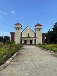 Seminari Sinar Buana: A Bright Yellow Church with a Serene Garden