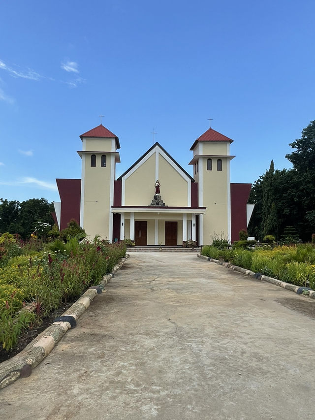 Seminari Sinar Buana: A Bright Yellow Church with a Serene Garden