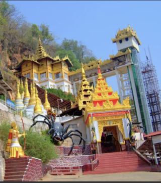 Shwe Oo Min Pagoda is located in Pindaya town, Shan State, Myanmar. 

🕷️ Pindaya is situated at the foot of a western range of Mene-mountain over 5,000 feet high and 3,880 feet above the sea level.

🕷️ Pindaya is located in a limestone ridge on a high plateau and the way from Taunggyi to Pindaya is full with scenic beauty of panorama mountains and the pleasant features in the Southern Shan State.

🕷️ Entering the plateau of Pindaya, the great mountain range appeared to dwarf the city and lake down below.

🕷️ Aged banyan trees lie along the way to the beautiful Pindaya Lake.

🕷️ You will see a welcome concrete sign-post with a huge black spider in the centre of its web towering above.

🕷️ This huge spider is connected with the legendary history of Pindaya.

🕷️ The 200 steps up the covered stairway leading to the cave entrance.

🕷️ The hike up Shwe Oo Min is relatively easy, there is also an elevator to help climb this cave.

🕷️ The caves are supposed to be 20,000 million years old and since ancient times they have been places of worship and veneration with 8,094 Buddha images made from various materials like teak wood, marble, alabaster, brick, cement and lacquer. 

🕷️ All enshrined in the nooks and corners of the winding caverns.

🕷️ At the entrance to the main cave there is a pagoda 50 feet in height. This pagoda is called Shwe Oo Min pagoda or the Golden Cave pagoda. 

🕷️ The entire length of the cave is 490 feet. 

🕷️ There are the famous sweating Buddhas, a series of jade images that are at all times covered by condensation. Devotees believe that people who rub the ‘sweat’ onto their own faces will be imbued with good fortune and beauty. It will find that their ailments are healed.  

🕷️ The famous stalactites stalagmites in these limestone caves are named as the “ Fairy Princess Loom”, “ Posts for tying horses and elephants” and so on.

🕷️ Among the unusual features in the cave is a set of stalagmites that can be struck with large wooden mallets to produce gong tone.

🕷️ Some of the smaller caves used as meditation chambers. 

🕷️ Shwe Oo Min Pagoda celebrates its festival around the full moon day Tabaung (during February or March).

🕷️ During the festival time, thousands of pilgrims and visitors come to the cave to pay homage.

🕗 Opening hours : 08:00 AM ~ 17:00 PM 

📪 Direction : 

▪️ The nearest airport is Heho, which receives flights from major cities like Yangon and Mandalay. 

▪️ From Heho Airport, it takes about 1.5 hours by car or taxi to reach Pindaya. 

▪️ Upon arriving Pindaya town, you can be reached easily by taxi, bicycle, or on foot depending on your preference. 

📅 The best time to visit is during November to February. 

🎟️ Admission Fee is FREE.

📍Tips : 

▪️Barefoot before entering the temple building.

▪️Dress modestly and respectfully. Should be covered shoulders and knees. Avoid see-through clothing.

▪️Carry water and stay hydrated.

▪️Visit early in the morning or late afternoon to avoid crowds and heat.

▪️Combine your visit with nearby sites Pindaya Caves and Pindaya Lake for a full day exploration.