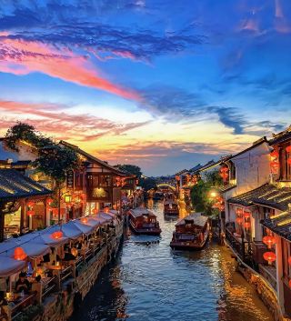 Which of Zhejiang's four ancient towns would you most like to visit with during the May Day holiday?