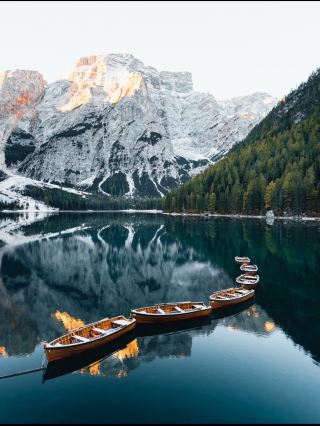 Lago di Braies, Dolomites, Italy 🇮🇹🏔️💚

Lago di Braies, also known as Pragser Wildsee, is one of the most breathtaking alpine lakes in the Dolomites of northern Italy. Surrounded by towering limestone peaks, dense forests, and crystal-clear turquoise water, it looks almost too perfect to be real.

The lake is especially famous for its traditional wooden boats and charming boathouse, sitting against a dramatic mountain backdrop. On a calm morning, the peaks reflect perfectly on the water, creating a scene that feels like a painting. 🚣♂️✨

Walking around the lake is an experience in itself. Every turn reveals a different view—deep green forests, rugged mountains, peaceful trails, and the incredible blue-green water.

Lago di Braies is one of those places you see in photographs and think it can’t possibly look that beautiful in real life—until you stand there and see it with your own eyes. 💚🏔️✨