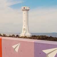 A Picturesque Coastal Beacon with Rustic Charm