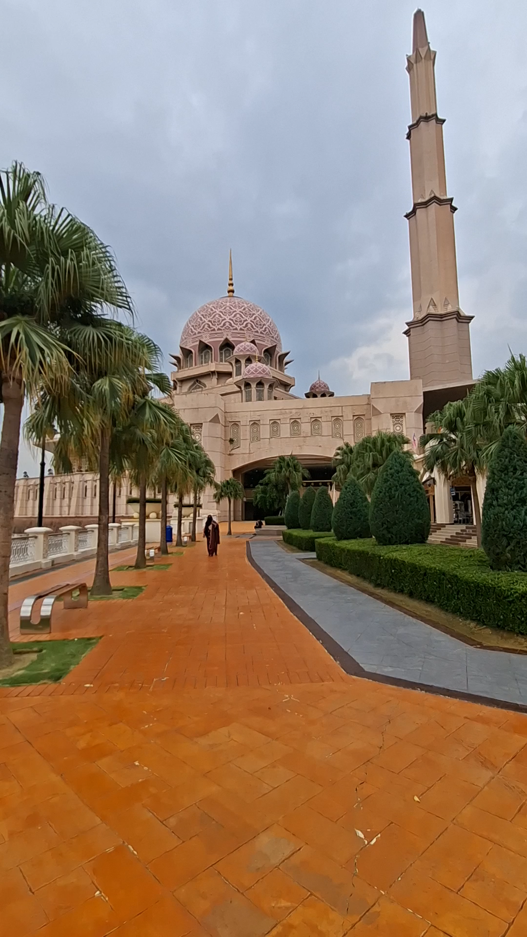 Putra Mosque, Putrajaya — A Magnificent Symbol of Islamic Heritage, Architecture and Malaysian Culture
The video captures the remarkable beauty of Putra Mosque, one of Malaysia’s most iconic religious and architectural landmarks. Located in the heart of Putrajaya, this magnificent mosque stands beside the picturesque Putrajaya Lake, creating a breathtaking setting where Islamic architecture, natural beauty and modern urban planning come together.
With its distinctive pink dome, elegant minaret, intricate decorative details, landscaped gardens and spacious walkways, Putra Mosque offers visitors a memorable glimpse into Malaysia’s rich Islamic heritage and multicultural identity. The peaceful surroundings make it an inspiring destination for worshippers, history enthusiasts, architecture lovers and travellers from around the world.
1. The History of Putra Mosque

The mosque was designed by architect Dato’ Dr. Nik Mohamed Mahmood of Senireka Group. Its construction brought together traditional Islamic architectural ideas and Malaysian design influences, creating a landmark that represents both the nation’s religious heritage and its aspirations for the future. 
Today, Putra Mosque is far more than an architectural attraction. It is an important place of worship, a centre for religious learning and community activities, and a symbol of Malaysia’s cultural identity.
2. The Beauty of Islamic Architecture
The pink central dome: A beautiful architectural centrepiece decorated with elaborate patterns and floral-inspired ornamentation.
The towering minaret: Rising approximately 116 metres, it is one of the mosque’s most recognisable features.
Intricate Islamic ornamentation: Geometric designs, decorative arches and elegant calligraphy reflect the sophistication of Islamic artistic traditions.
Traditional wood craftsmanship: Carefully designed wooden details add warmth and character to the building.
The spacious prayer hall and courtyard: These areas provide space for worship, reflection, religious education and community gatherings.
The mosque can accommodate approximately 15,000 worshippers, including the main prayer hall and courtyard. Its design demonstrates how traditional architectural heritage can be expressed through modern construction. 
3. Putrajaya: A Modern City with a Rich Cultural Identity

Putra Mosque occupies a prominent position beside Putrajaya Lake and near Putra Square and Perdana Putra, the complex that houses the Prime Minister’s Office. Together, these landmarks form one of the city’s most recognisable architectural landscapes. 
The surrounding area is particularly beautiful for visitors who enjoy photography, walking beside the water and exploring the relationship between architecture and nature. The mosque’s pink exterior stands in striking contrast to the greenery, palm trees, blue waters and changing colours of the sky.
4. Malaysian Heritage, Traditions and Multicultural Culture
Visiting this landmark is therefore not simply about admiring a beautiful building. It is also an opportunity to understand how faith, history, architecture and cultural identity come together in contemporary Malaysia.
5. Religious Ceremonies, Cultural Programmes and Community Events

The mosque also has facilities for conferences, seminars, exhibitions and other community functions. Specific events and their schedules vary, so visitors should check official announcements if they wish to attend a particular programme. 
Although the video showcases the mosque’s architecture and peaceful surroundings rather than a specific ceremony, these community traditions help explain the wider cultural importance of this landmark.
6. The Peaceful Beauty of the Mosque and Its Surroundings
Putra Mosque is a place where architecture tells a story, history inspires reflection and cultural traditions continue to shape community life. Its magnificent pink dome, elegant minaret and beautiful lakeside setting make it one of Malaysia’s most memorable landmarks.
From its historical connection to Malaysia’s founding generation to its role in contemporary religious and community life, the mosque represents a meaningful connection between the past and the present.
The video captures more than the beauty of a building. It offers a glimpse into the spirit of Putrajaya and the rich Islamic heritage that forms an important part of Malaysia’s identity.
Putra Mosque reminds us that the most beautiful landmarks are not only admired for their appearance, but also cherished for the history, faith and human stories they represent.
#PutraMosque  #Putrajaya  #Malaysia  #PinkMosque  #IslamicArchitecture  #MalaysianHeritage  #CulturalHeritage  #TravelMalaysia  #BeautifulPlaces  #WorldArchitecture  #TravelPhotography  #DiscoverMalaysia 