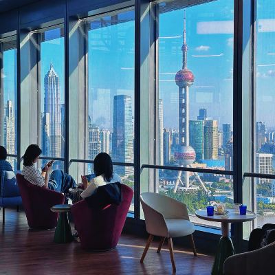 People's Cafe river view in Shanghai with skyline through the windows