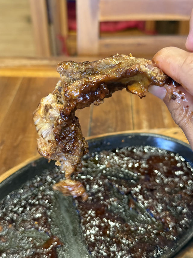 Steamy pork ribs in Kuta wooden shack