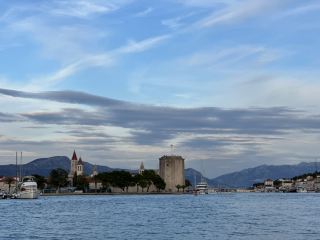 Discovering the flavors of San Priamo is the perfect way to amp up the romance after a stroll through Trogir’s dreamy old town! Whether you’re tracking down cozy spots for date night or hunting for a quick snack with charming views, this small town’s food scene is overflowing with heart.

For a memorable dining experience:
Trattoria San Priamo  
Signature Dishes: Homemade ravioli stuffed with ricotta and spinach is an absolute must, paired with the local lamb stew that’s slow-cooked to perfection.  
Vibe: Rustic and intimate, perfect for couples. Candlelight and stone walls amp up the romance.  
Opening Hours: 12:00 PM - 10:30 PM (Monday-Saturday), closed Sundays  
Key Strengths: Family-run for generations—expect authentic Sardinian hospitality with each plate. The terrace offers a breathtaking view over the old town’s rooftops—book ahead for sunset!

For something sweet and fun:  
Gelateria Bella Vista  
Signature Treats: Pistachio gelato and lemon sorbet—refreshing after a sunny day exploring!  
Vibe: Lively, with a few outdoor tables right next to the ancient city wall.  
Opening Hours: 10:00 AM - 10:00 PM  
Key Strengths: Uses locally-sourced milk and fruits. Super friendly staff—don’t miss the cute mini cones!

Personal tip: Take your gelato for a walk and find a quiet bench by the harbor for a picture-perfect end to your evening.

Pro tip: Trogir’s old town gets magical at golden hour, so time your dinner or dessert to enjoy those unforgettable views!

#SanPriamo #Trogir #CoupleTrip #OldTown #LocalEats
