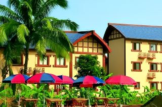 Stay at the Baoting Bulongsai Tropical Rainforest Resort. 