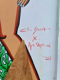 Citra Sasmita's enigmatic wall art at the Bali Kuta bus station.