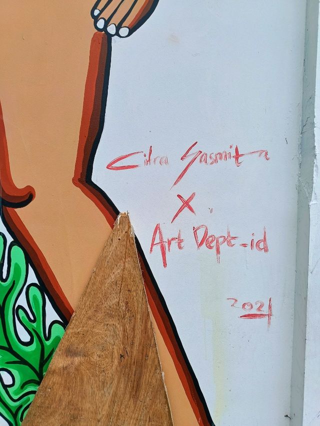 Citra Sasmita's enigmatic wall art at the Bali Kuta bus station.