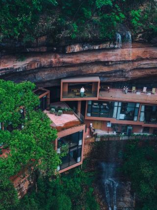 Hidden beneath a waterfall, this magical hotel