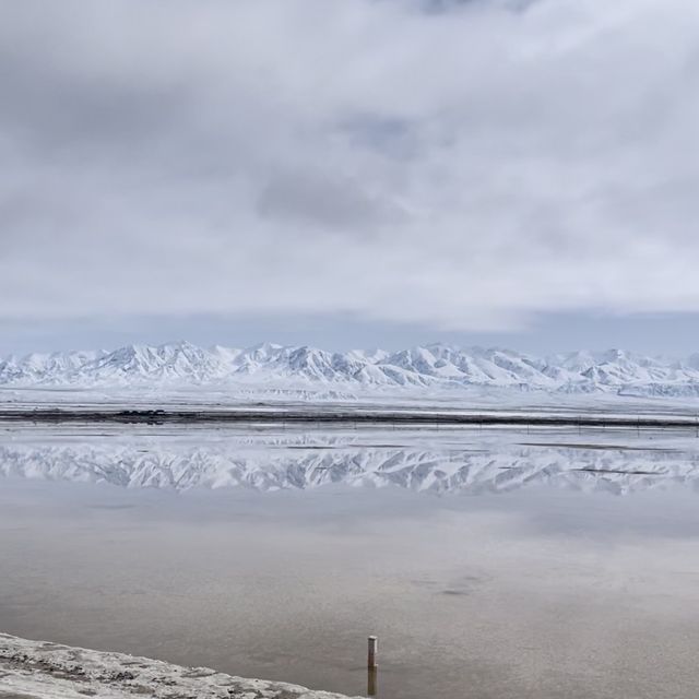 A Fairy lake surrounded by snowy mountains  