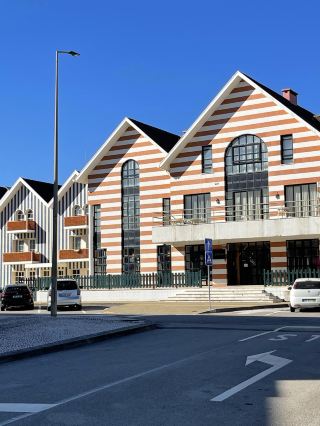 🇵🇹 Costa Nova | Portugal 🌊☀️

Costa Nova is another charming coastal town in Portugal. Located near Aveiro, it's perfect for a relaxing, unhurried stroll.

This is a photogenic waterfront promenade that we really enjoyed. The sky was bright blue that day, the sun was shining beautifully, and we could see the vast expanse of water on one side, while houses lined the street on the other. The atmosphere was peaceful and serene; we couldn't help but find our way.

What we loved most was the long, curving coastal promenade. The view was stunning, especially on a beautiful day like this. Just walking along, taking photos, and enjoying the surroundings was incredibly peaceful.

Costa Nova also has another highlight: its brightly colored, striped houses, a unique characteristic of the town. If you're visiting Aveiro, we highly recommend making time to stop by Costa Nova.

It's a place that doesn't offer complicated activities, but its charm lies in its simplicity. Just strolling around, enjoying the breeze, admiring the view, and soaking up the relaxed seaside atmosphere of Portugal was worth it! 💙

📍 Costa Nova, Aveiro, Portugal 🇵🇹

#CostaNova #Aveiro #Portugal #TravelPortugal #OverseasTravelReview #SelfGuidedTravel #EuropeTrip