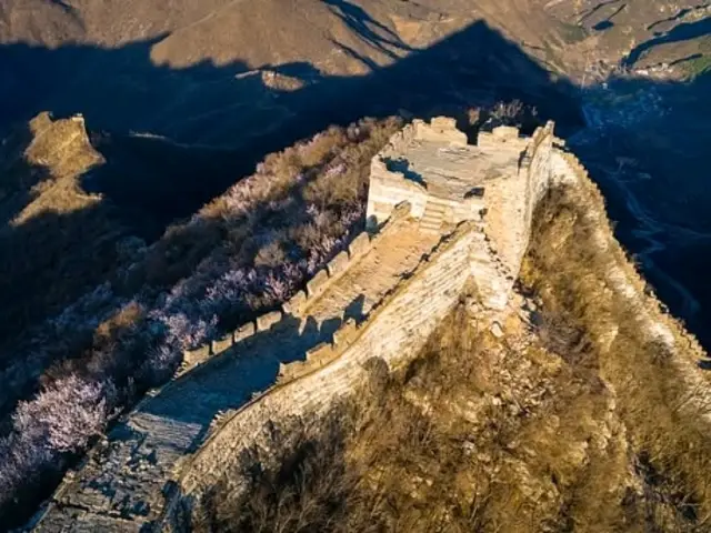 unrestored section of the Great Wall, it is rugged, wild