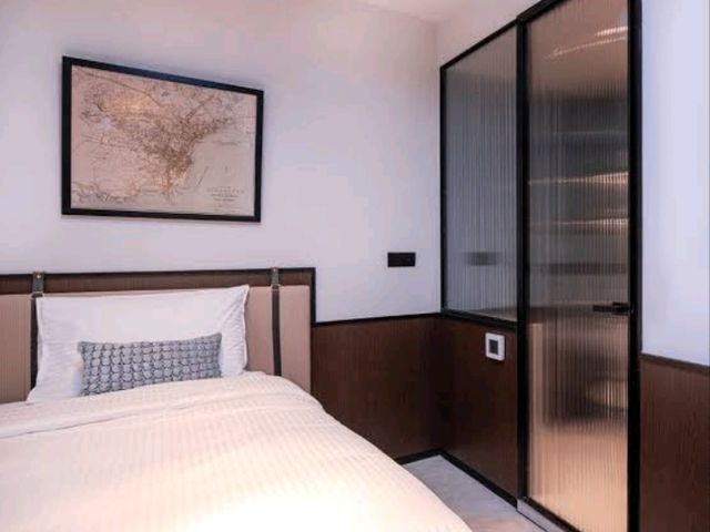 Interiors are clean, minimalist, and smart, featuring comfortable bedding, smart TVs, and en-suite