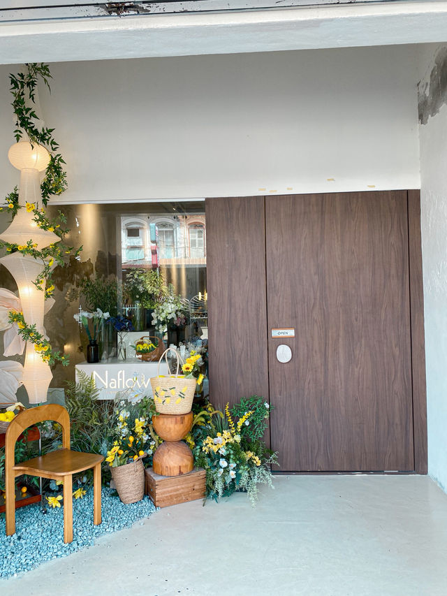 Cafe with beautiful fresh flowers in store, Penang