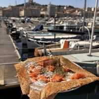 Savour a crepe by the stunning old port!
