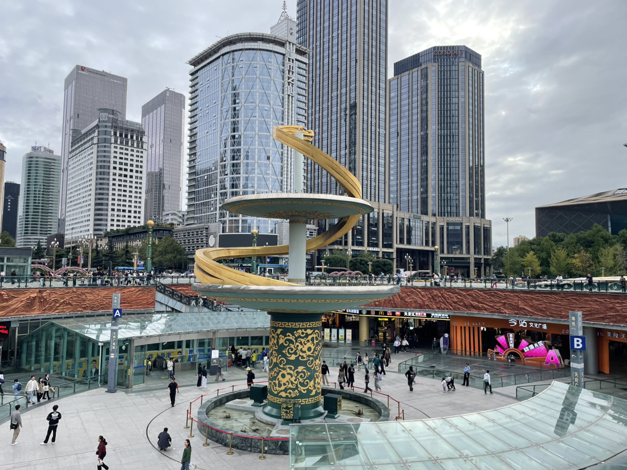 Spend a day in Chengdu, the capital of Sichuan Province, a city that beautifully blends modernity with traditional lifestyles. Start your day at Tianfu Square, the heart of the city, surrounded by towering buildings and a grand fountain.

Next, enjoy a leisurely bike ride to People’s Park, a green oasis where locals relax, drink tea, chat, and sing karaoke outdoors. You might want to sip tea in a pavilion by the pond.

In the evening, don’t miss the city’s signature dish, Suan Cai Yu (Pickled Mustard Fish). This delightful dish combines sour, salty, and spicy flavors perfectly, with tender fresh fish in a broth infused with the aroma of chili and Sichuan pepper. It’s a must-try for anyone visiting Chengdu.

End your day with a refreshing drink at Cha Panda Café, a famous tea shop in the city decorated with an adorable panda theme.

Estimated daily expenses: 500 THB.