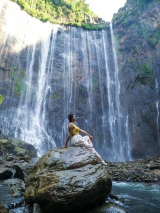 Tumpak Sewu Waterfall: Indonesia’s “Thousand Waterfalls” is pure jaw-drop territory! 🌊🌿 Hidden deep within East Java, its horseshoe curtain of water plunging over lush cliffs is guaranteed to fill your camera roll (and your soul). 

Start at the panoramic viewpoint near Pronojiwo for that classic, sweeping vista—the ultimate “insta-worthy” shot, especially just after sunrise when the mist catches the light. For the real adventure, follow the steep, slippery path down to the base. Expect bamboo ladders, slick rocks, and muddy steps (bring sturdy shoes and a sense of adventure!). Once you reach the bottom, the thundering walls of water and fine spray transport you to a tropical Jurassic Park. Don’t miss wading downstream for the magical lower perspective—where every angle feels epic.

Tips: 
Bring a waterproof bag for electronics—the spray is intense at the bottom! A change of clothes is wise. Arrive early (before 9 AM) to beat the crowds and enjoy softer light for photos. Hire a local guide at the entrance if you’re not confident descending the canyon—safety first! The trail can be challenging after rain and is not recommended for those with mobility concerns.

Precautions: 
The descent is steep and can be extremely slippery—take your time and skip it in heavy rain. Be mindful of strong currents near the pool base. Little local warungs at the entrance serve tasty snacks for post-hike rewards!

#TumpakSewu  #EastJava  #Waterfalls  #TravelTips  #NatureLovers 