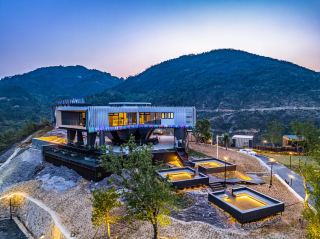 A stunning resort hotel, a castle in the sky on a cliff.