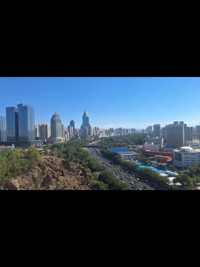 Ürümqi: Where Cultures Meet Under the Tianshan Mountains 🏔️🌆 Ürümqi: Where Cultures Meet Under the Tianshan Mountains 🏔️🌆