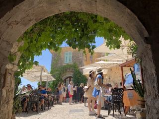 Walking through a Mediterranean cliffside village