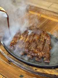 Steamy pork ribs in Kuta wooden shack
