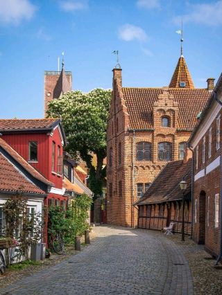 Review of a trip to Ribe, Denmark 🇩🇰🏘️
One of Denmark's oldest historical cities, known for its cobblestone streets, medieval wooden houses, and charming old town atmosphere. Perfect for history buffs and photography enthusiasts.
📍 Recommended Places
Ribe Old Town ⭐⭐⭐⭐⭐
The old town area with cobblestone streets, colorful old houses, and traditional wooden buildings. Strolling around feels like stepping back in time to the Middle Ages.
Ribe Cathedral ⭐⭐⭐⭐⭐
An ancient cathedral and a major landmark of the city, notable for its architecture reflecting Ribe's long history.
Ribe Viking Center ⭐⭐⭐⭐⭐
A learning center about Viking history that recreates the atmosphere of an ancient village, allowing visitors to experience Viking stories up close.
Ribe River & Marshes ⭐⭐⭐⭐
Natural areas surrounding the city, perfect for strolling, enjoying the views, and experiencing the Danish countryside.
🗓 Itinerary
Day 1
Explore Ribe Old Town
Visit Ribe Cathedral
Walk along the old streets and take photos of the wooden houses
Stop at a local cafe
Day 2:
Visit the Ribe Viking Center in the evening.
Learn about Viking history.
Stroll along the Ribe River.
Enjoy the surrounding nature before your return journey.
⭐ Impressions:
Ribe is a very charming city for those who love history and old towns. Narrow cobblestone streets, old wooden houses, and medieval buildings create an atmosphere like stepping back in time. Walking along the small alleys and admiring the colorful houses is a simple yet very memorable experience.
Especially in the evening, when the sunlight shines on the old buildings, the city looks even more romantic and perfect for photography.
⭐ Rating:
Beauty: 9.8/10
Atmosphere: 10/10
History: 10/10
Value for money: 9.7/10
Overall score: 9.9/10
"Ribe is a city that takes us back in time to experience medieval Denmark. Cobblestone streets, old wooden houses, and a magnificent cathedral." Every corner of the city is filled with memorable stories and charm."
#TripMoments #Ribe #Denmark #RibeOldTown #RibeCathedral #RibeVikingCenter #VisitDenmark #MedievalTown #TravelDenmark #TripcomCreator #TravelDenmark #TravelRibe #OldTownDenmark #VikingHistory #DenmarkTravel #TravelPhotography #Wanderlust