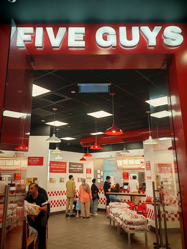 The only thing better than the view? These juicy burgers. 🍔💯 #FiveGuysGenting