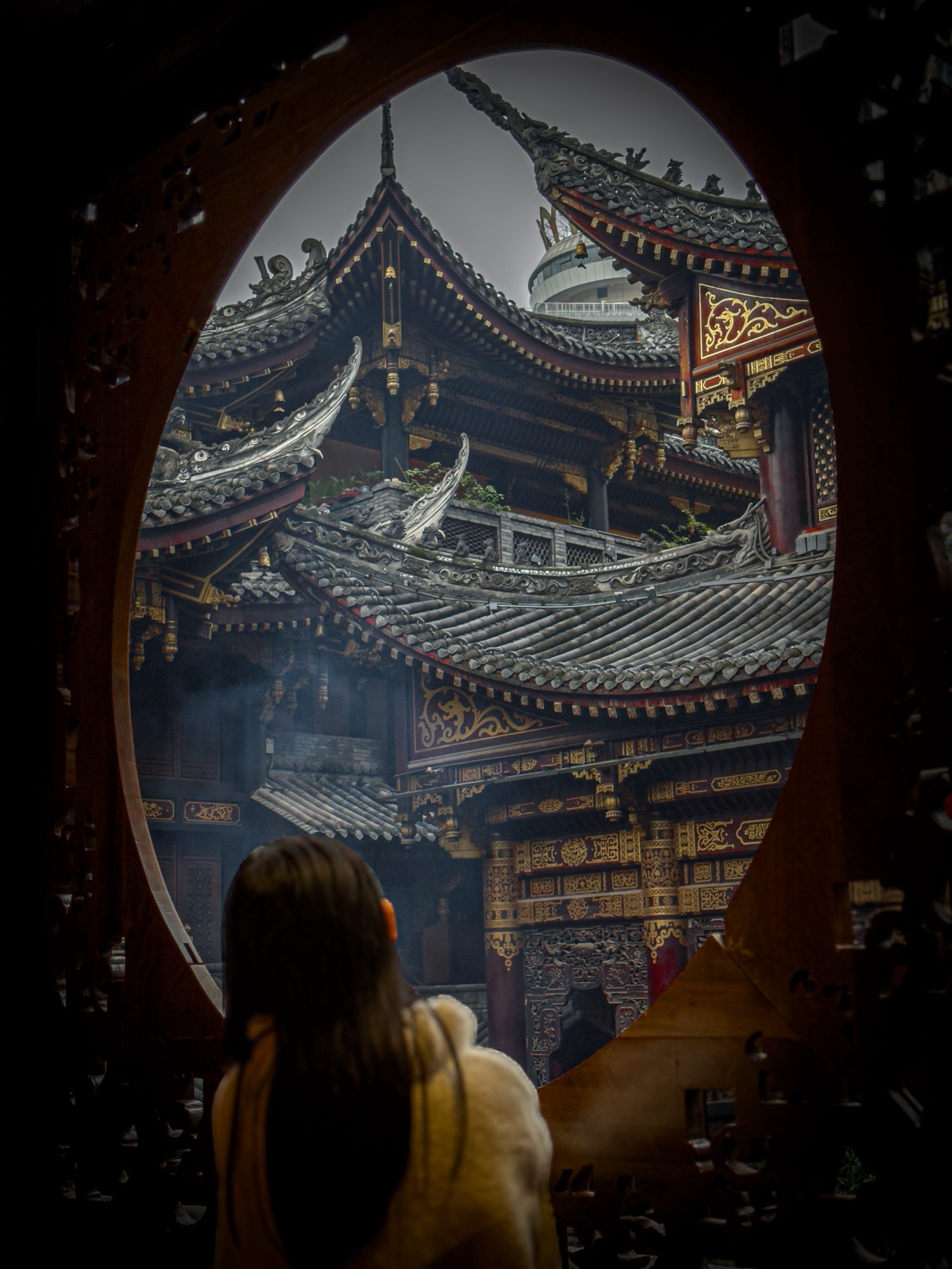 If you're looking to escape the hustle and bustle of Chongqing's city center for a peaceful retreat, Luohan Temple (罗汉寺) is a perfect choice. Unlike the busy city streets, the temple offers a serene and historic atmosphere, providing travelers with a healing space.

Basic Information
• Admission Fee: 20 RMB
• Operating Hours: 8:00 AM - 6:00 PM
• Address: XX District, Chongqing (Check Trip.com map for exact location)
• Recommended Visit Duration: 1-2 hours

Travel Review
As you step into the temple entrance, the tiled roofs and golden decorations immediately catch your eye. Inside, rows of Arhat statues are lined up, each with unique poses and expressions, making it enjoyable to observe them in detail. The ancient Arhat statues in the Thousand Buddha Hall are intricately crafted with gold leaf and wooden decorations, allowing you to feel both the passage of time and the artisans' dedication.

The temple also serves as a healing space amidst the city. After exploring the temple, sitting on a bench and taking in the surroundings can bring a sense of calm and clarity.

Nearby tea houses are a great place to continue the tranquility with a warm cup of tea. It's also an excellent spot for photography and a perfect place for those looking to relax during their travels.

Travel Tips
• The temple is a sacred space, so please maintain silence while visiting.
• There are small snack and drink stalls near the entrance.
• Photography is generally allowed, but some areas may prohibit it.

If you're seeking a quiet getaway in Chongqing, be sure to include Luohan Temple in your itinerary. With its affordable admission fee and easy accessibility from the city center, it's a hassle-free and enjoyable destination. 🌿