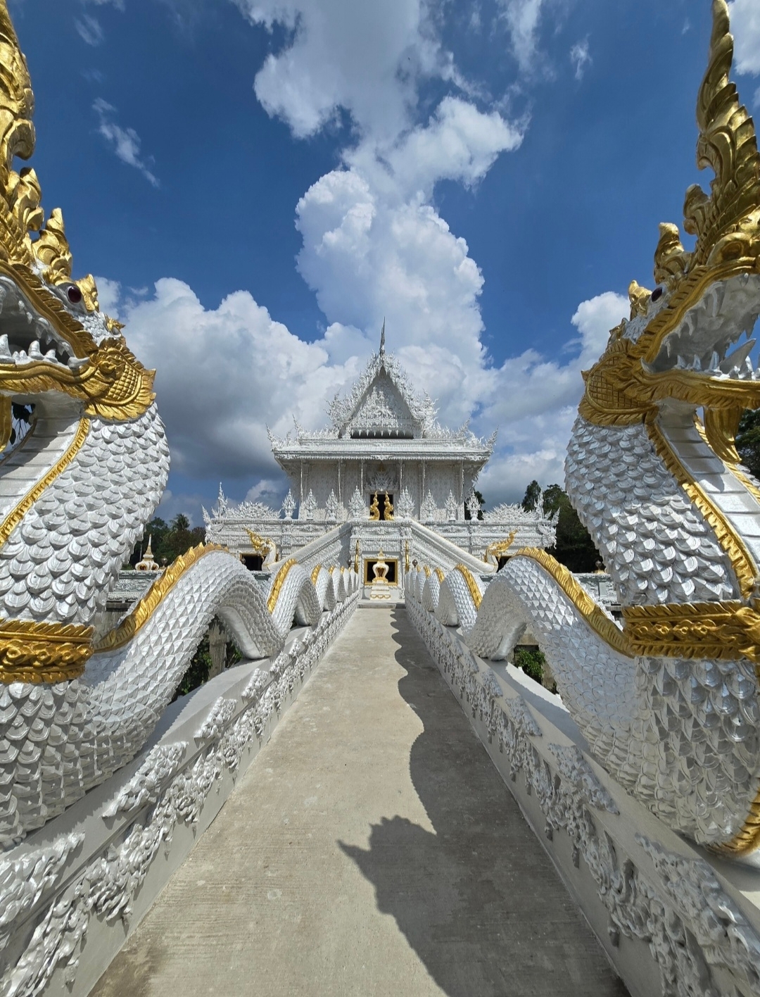 I arrived at Wat Kanan in the morning, so there were very few people—I was able to walk around peacefully and take everything in without the crowds. I didn't see any monks this time, though.

The temple itself looks very unusual and even a bit magical. There are many beautiful details and interesting architecture; everything is vibrant, neat, and incredibly photogenic. A lovely pond surrounds the temple, which only adds to the atmosphere.

Nearby, you can rent a traditional Thai costume and have a photoshoot on the grounds—the location is perfect for it.
I loved how quiet and serene it was, yet the temple itself doesn't look boring or generic at all. If you're in the area, I would definitely recommend stopping by, even if just for a short bit.

  trip   trip