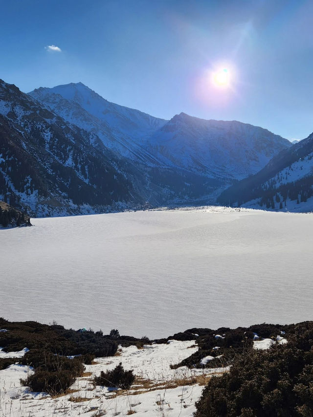 Still waters, snowy peaks, and silence