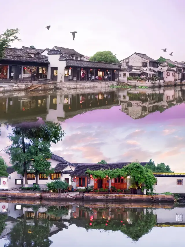 Escape the summer heat in the ancient towns of Jiangnan, with the misty rain of Xitang