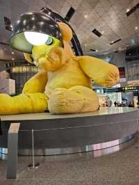 Between Benz and Bear: A Surreal Stroll Through Hamad Airport