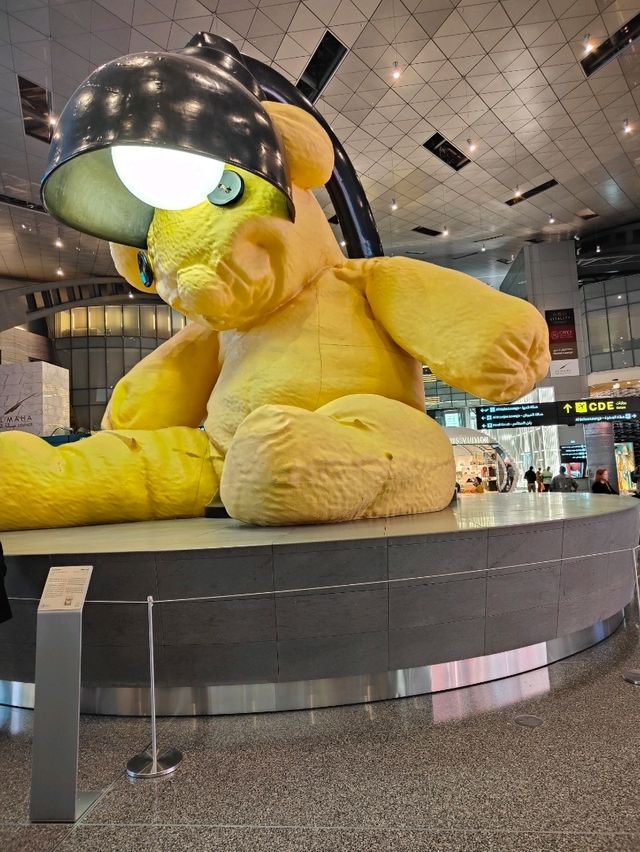 Between Benz and Bear: A Surreal Stroll Through Hamad Airport