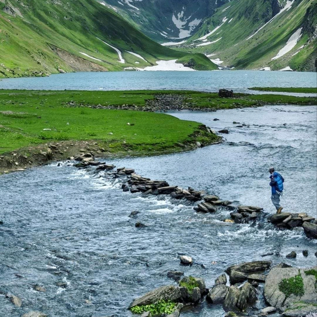 A man passing by the stream 