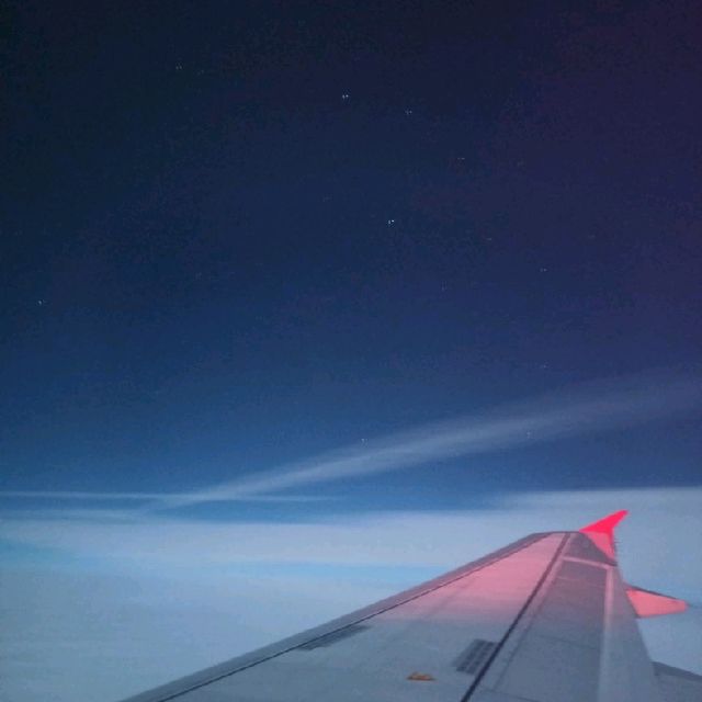 Taking photos of the starry night on a red eye flight