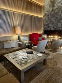 A lobby lounge with a fireplace🥂