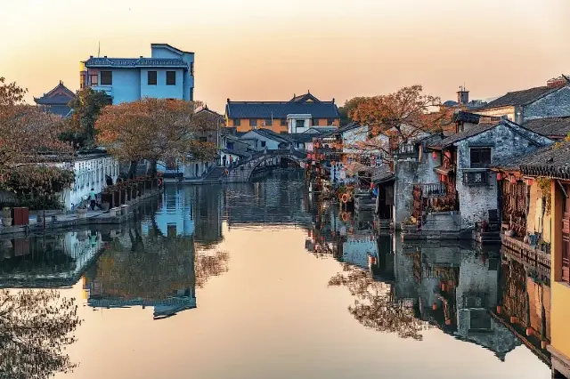 This is what I truly envision as a picturesque village with a small bridge over a flowing stream | Anchang Ancient Town