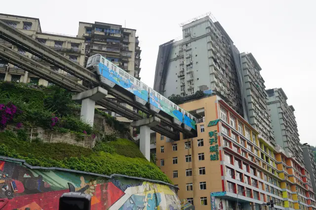 Chongqing's unique scene where a train passes through a building