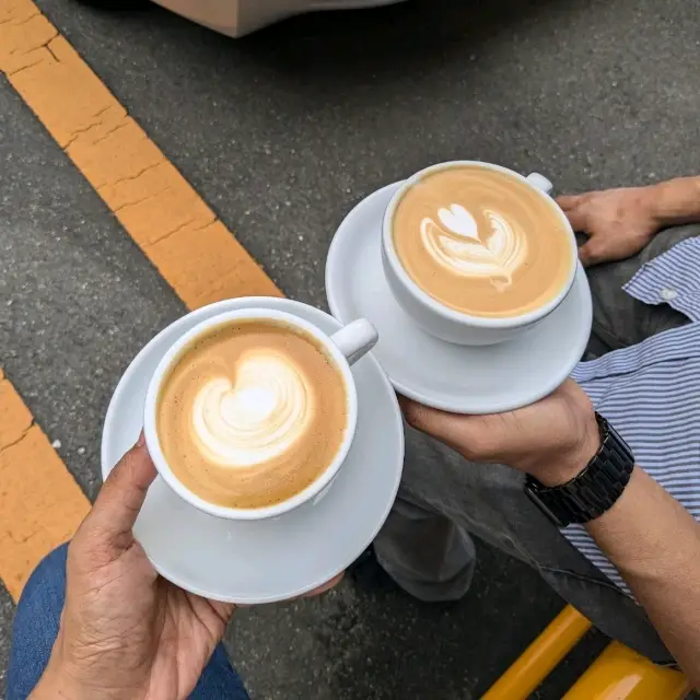 a nice little cafe by a parking lot