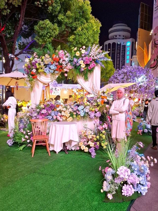 PURPLE FLOWERS AND GLOWING LIGHTS IN SHUNCHENG SHOPPING MALL