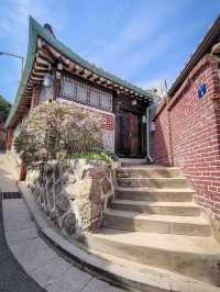 Bukchon Hanok Village: Time-Travel Through Seoul’s Most Photogenic Alleys"** 🏮🏡